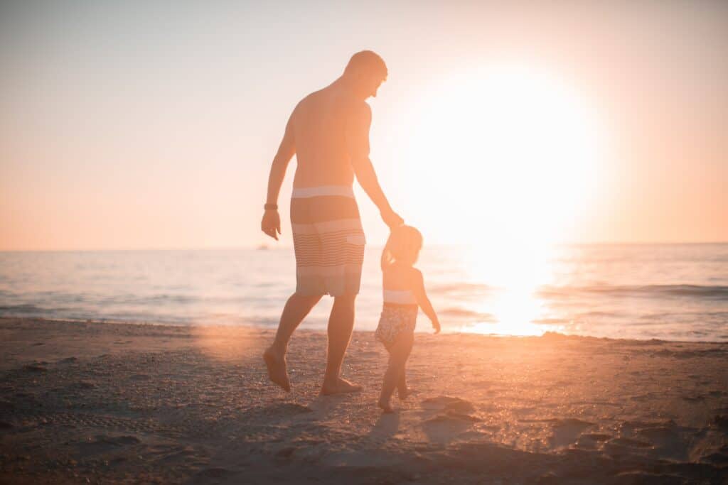 man and son on the beach